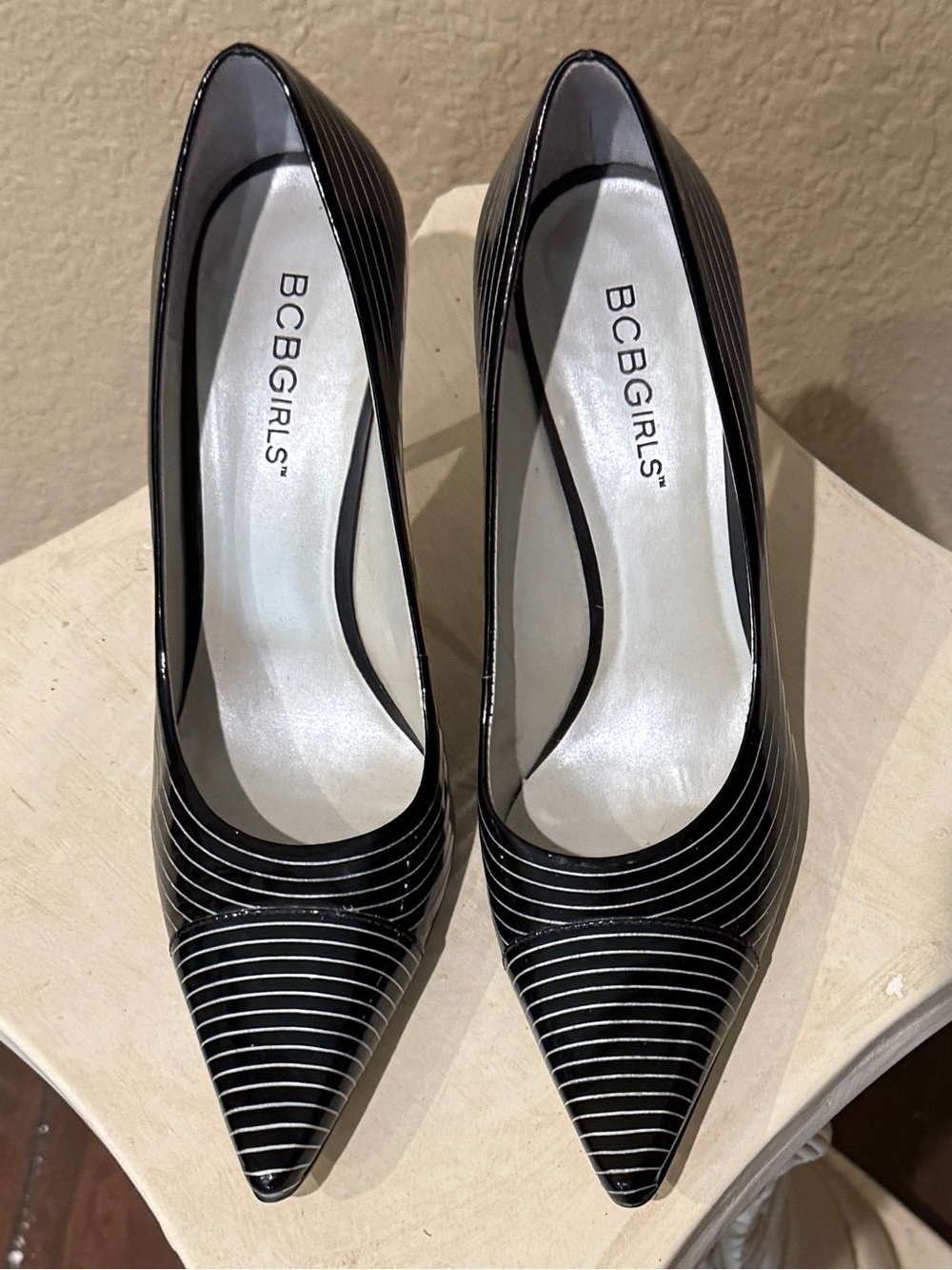 BCBGirls Black and White Striped Patton Leather Style Pointed-Toe Pumps